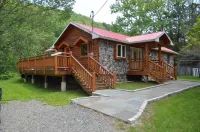 Spectacular Catskill Mountain River Front Custom Log Home
