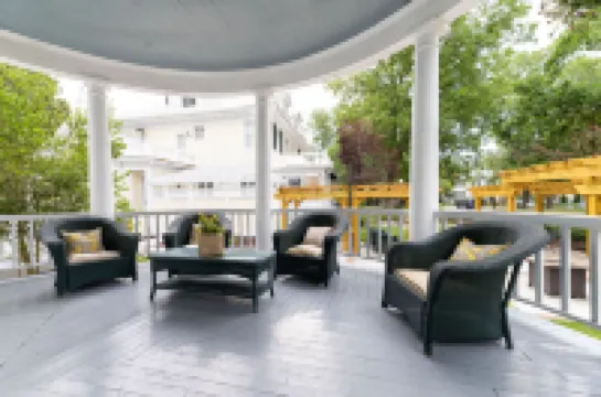 Charming Sitting Porch and Cozy Amenities - Delightful Escape