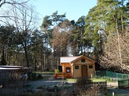 Comfortable log house in the forest community of Borkheide Отели в г. Боркхайде