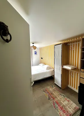 Bedroom with bathroom and garden in Maison Meulière Hotels in Chelles