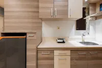 Calming Wooden Touch Studio Room At Apartment Soekarno Hatta (Suhat) Malang - Apartments