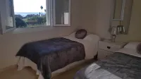 ApartmentSleeps4-Pool-BBQ-Garden-AC