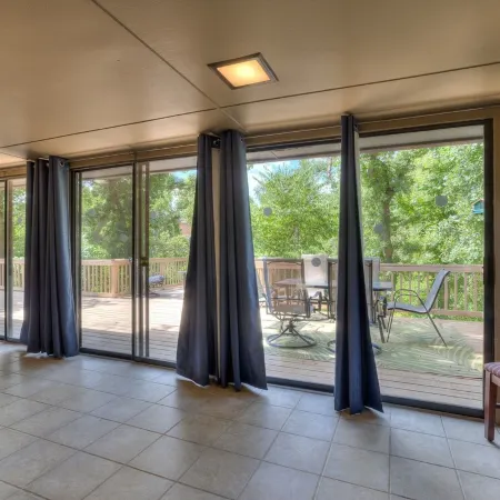 Quiet, spacious home with large deck in secluded Forest Oaks in central Edmond .