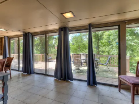 Quiet, spacious home with large deck in secluded Forest Oaks in central Edmond .