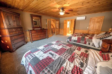 Exceptional log home on 9+ acres with frontage on Big St. Germain Lake