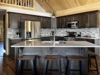 Beautiful hand-crafted log cabin on Horse Creek one block off Main Street.