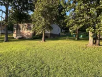 Relax at Grandma’s house with a screened in porch overlooking a private lake!