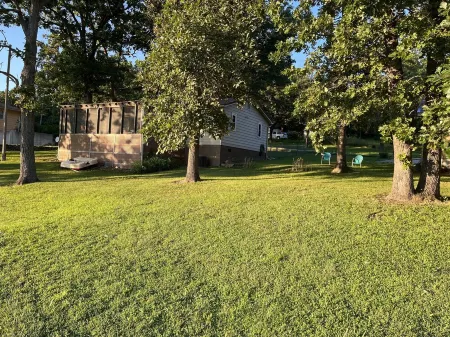Relax at Grandma’s house with a screened in porch overlooking a private lake!