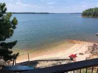 Cozy Lakefront Log cabin with miles of view plus small beach!