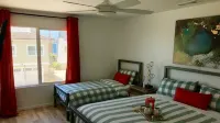 Steps to sand! Ocean view, Walk to village, family friendly, A/C!