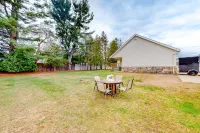 Warm & inviting retreat with a full kitchen, gas fireplace, & furnished patio