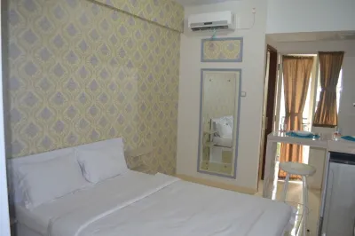 Apartment Green Lake View by Property Time Hotel dekat UNPAM Witana Harja