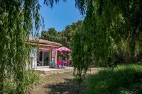 house located in a haven of greenery 15 minutes walk from the beach of Maora