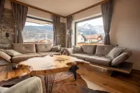 Modern chalet with a wraparound balcony with majestic views of the mountains