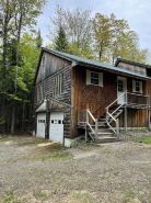 Tranquil cabin in the woods with heated garage.
