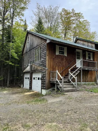 Tranquil cabin in the woods with heated garage.
