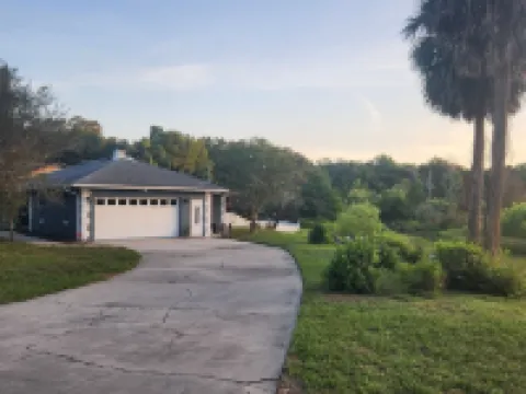 Charming lakefront 3BR 3BA house w/ EV chg in heart of Mt. Dora. Nature abounds.