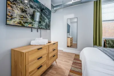 OTR, 1blk to TQL, Cali King Bed, Sleeps 4, Free Light Rail, 58in TVs, Wifi Hotels near Holy Cross - Immaculata Parish