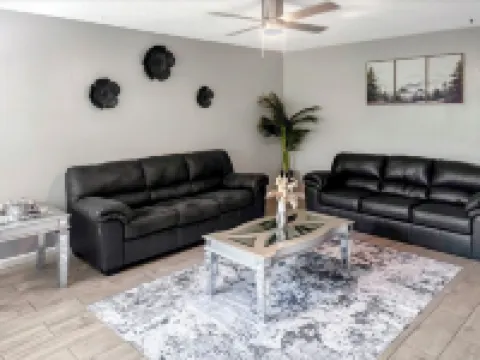 Beautiful Home in quiet neighborhood with a pool and close to stores & highways.