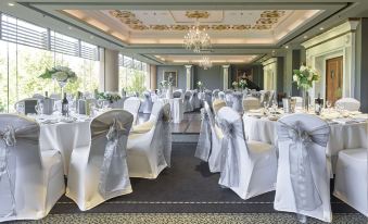 a large banquet hall with numerous tables and chairs set up for a formal event at Stamford Plaza Adelaide