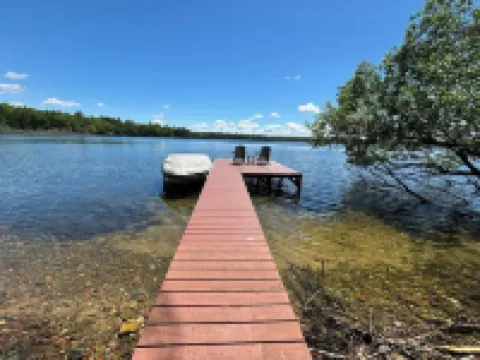 Beautiful 3 bed/2bath updated cabin w sandy swimmable frontage & great fishing.