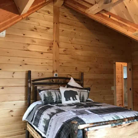 Luxury Log home steps from private beach in Meredith on Lake Winnipesaukee.