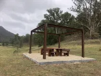 Brand new cabin with cliff views, hiking trails, heated spa, farm stay