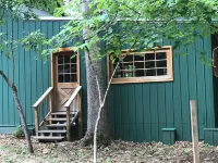 Cozy Cabin in Secluded Forest with Deck on Creek. Full Kitchen. 900 Square Feet.