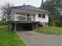 Vacation bungalow with a garden property only 3 minutes away from the beach Hotel a Scharbeutz