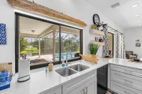 Large Pool/Spa Home Minutes from Beach with Arcade Games and Canal for Fishing.