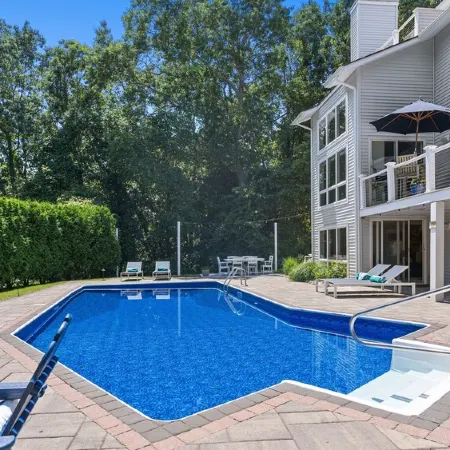 Modern coastal retreat w/ pool,  close to beaches and golf courses.