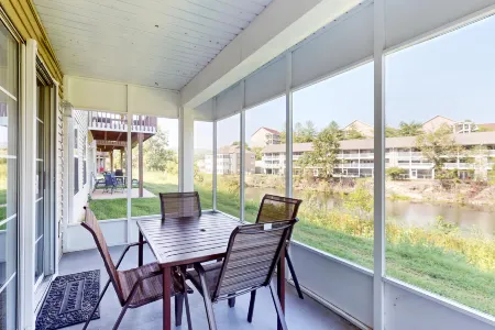 Single-level condo with screened patio & pond views