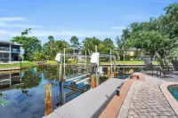 spectacular architectural home steps to the beach w/private heated pool on canal