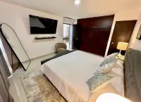New modern 2 bed 2 bath condo steps away from the beach with rooftop pool deck!