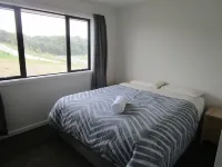 Apartment with lake, mountain & rural views.