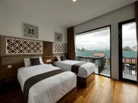 โรงแรม Mulia Syariah - ที่มีที่จอดรถ