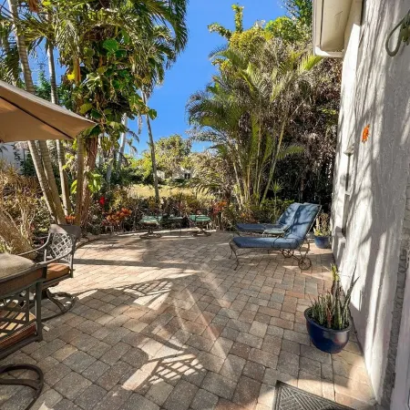 5-8 MINUTE WALK TO BEACHES, DINING & SHOPPING! RARE PRIVATE PATIO & LAKE VIEW!