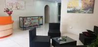 Queen's Comfort Inn Hoteles en Puerto España