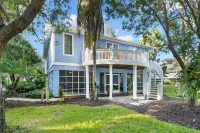 Community Pool Views and Spacious Verandas - Charming Island Retreat