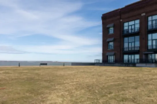 Balcony with Partial Lake View and Pool Access - Charming Condo Escape