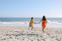 Spacious Deck with Peek-a-Boo Water Views - Exquisite Coastal Haven