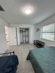 Charming 4-bedroom house with WiFi, pool, fitness room in peaceful Boynton Beach