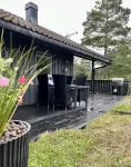 Cozy vacation home in southern Norway (Tromøy, Arendal) with a boat and a pier.