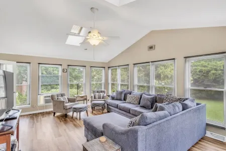 4BR Stay: Pet-Friendly, Sunroom, Fence & Fire Pit