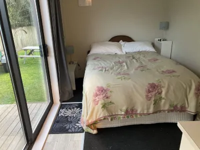 Kiwi Bach Plus Cabin with Room for Tents and Boat Hotels in 