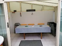 House near beach, port and shops, quiet area, private parking and courtyard.