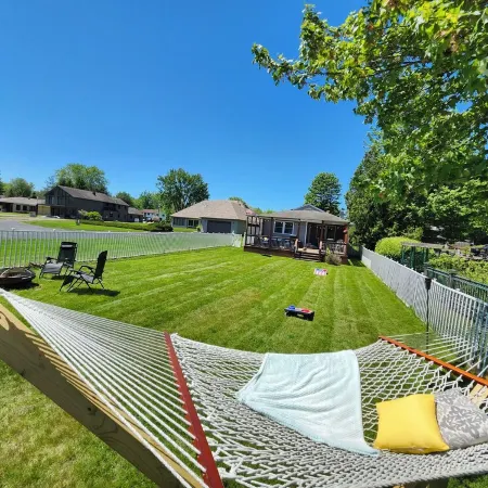 Spacious 4-bedroom waterfront house in Sylvan Beach with private yard and dock.