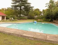 En-suite family size room with pool view.