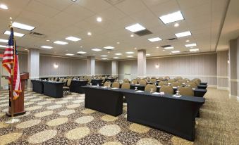 a large conference room with rows of tables and chairs arranged for a meeting or event at Hilton Garden Inn Philadelphia/Ft. Washington