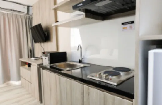 Minimalist Studio Room at Bintaro Icon Apartment by Travelio